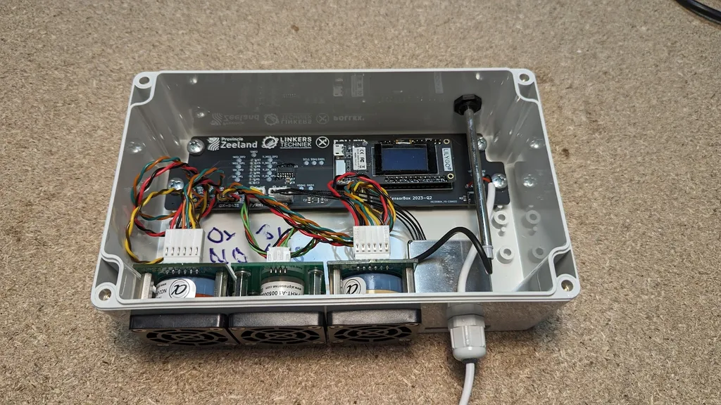 Gray box with sensor inlets for measuring air quality